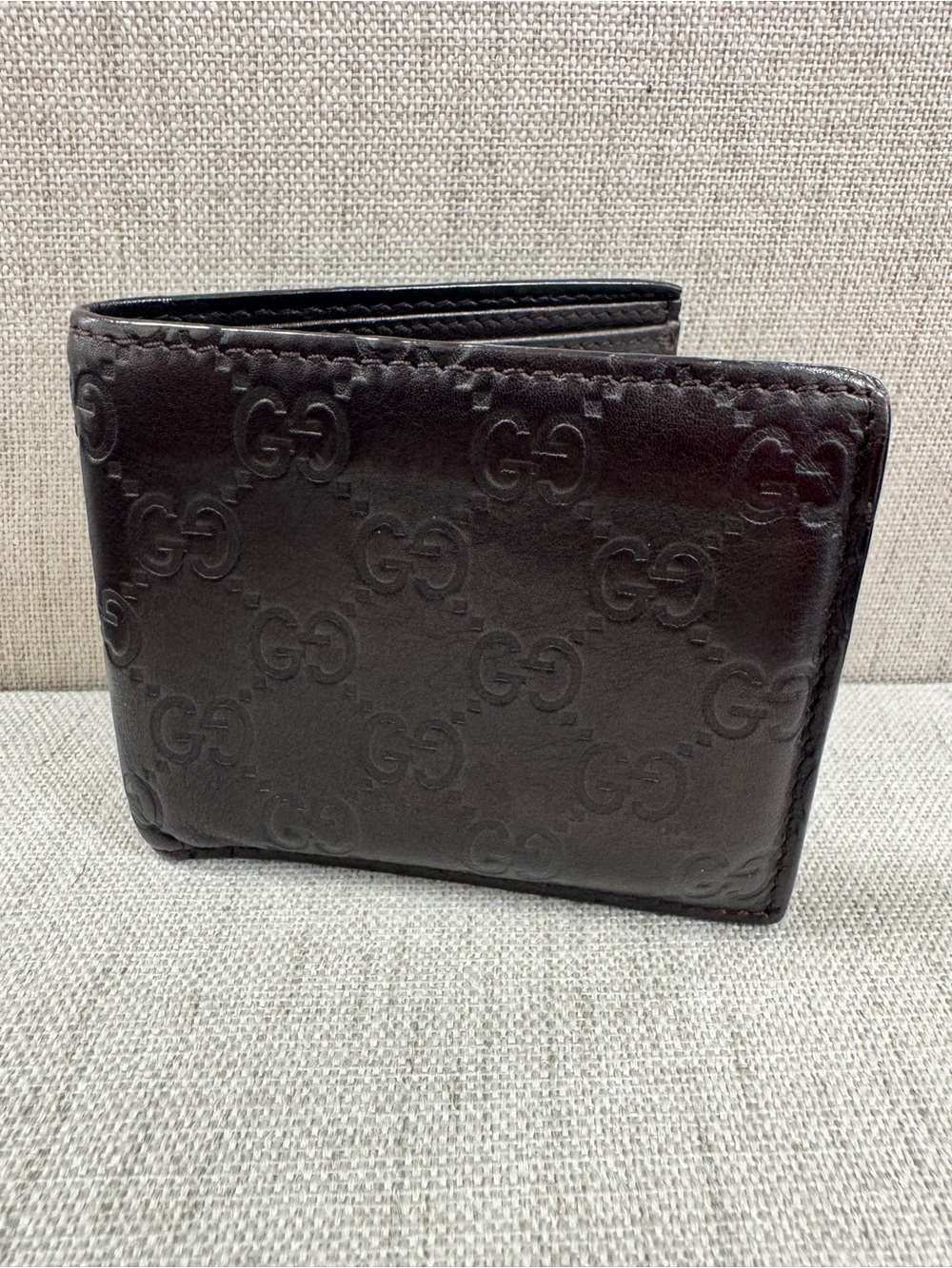 Gucci Dark Brown Embossed GG Leather Bifold Wallet